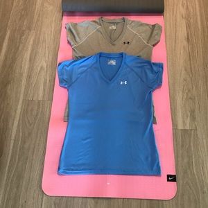 Two (2) UA vneck shirts